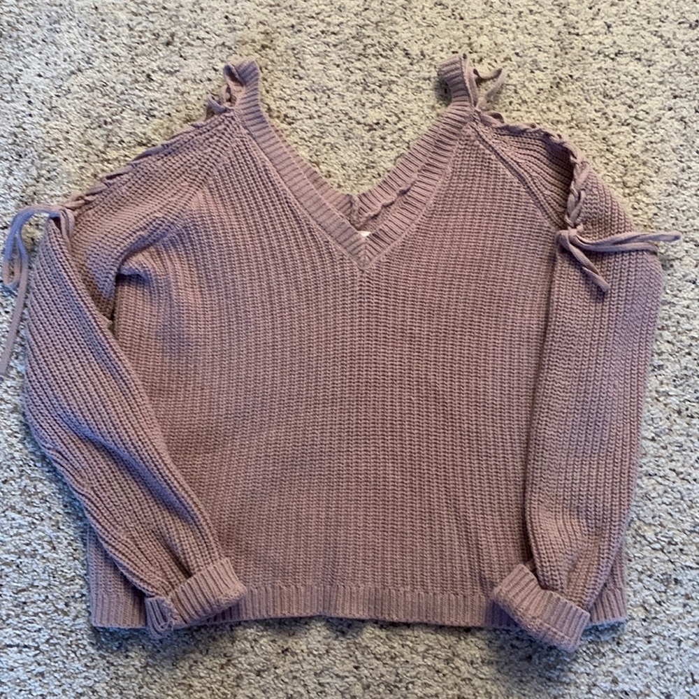 Mauve colored sweater with a V-neck and laced arms. Size small